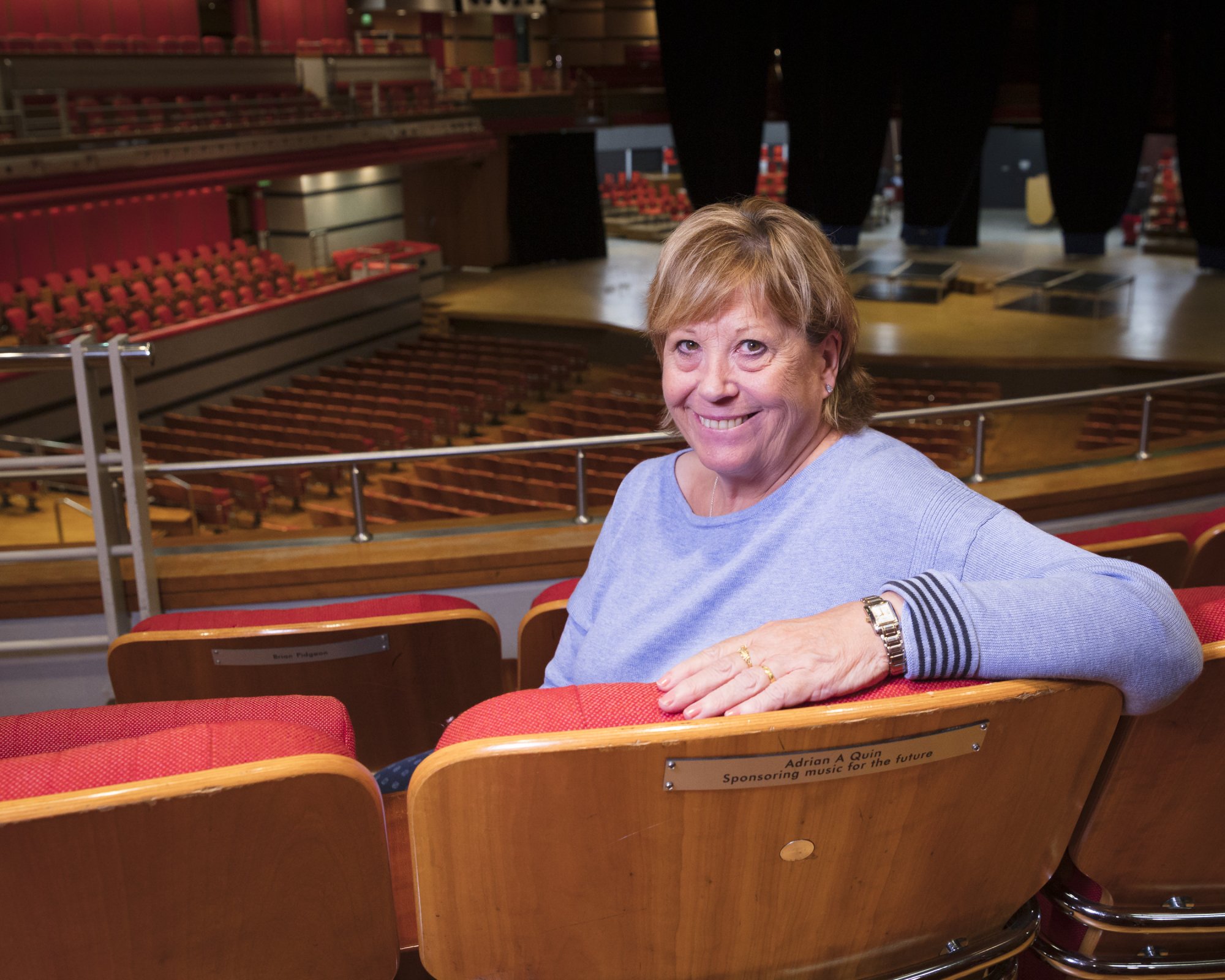 Glenda pictured in the seat dedicated to her husband, Adrian Quin.
