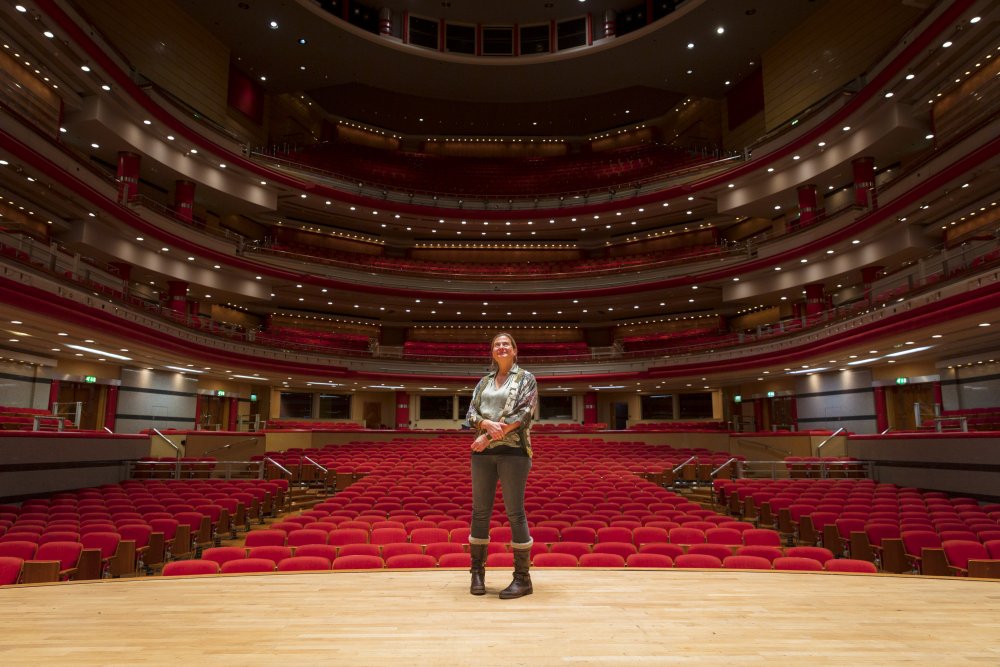 Ciara Bird on stage at Symphony Hall, looking back into the seats.