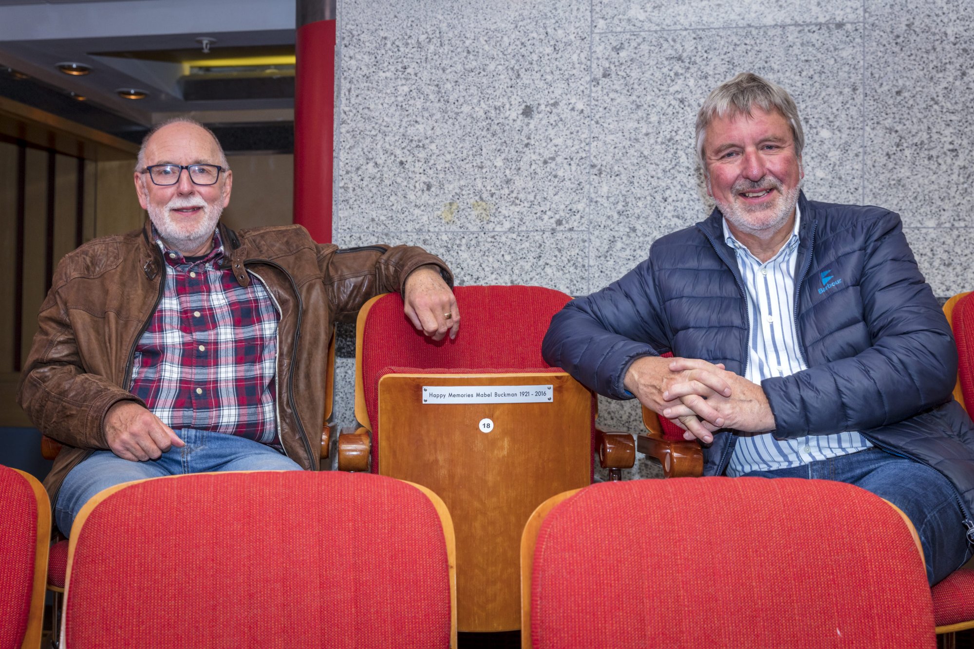 Steve (L) and Andrew (R) sit alongside the seat dedicated to their mother, Mabel Buckman.